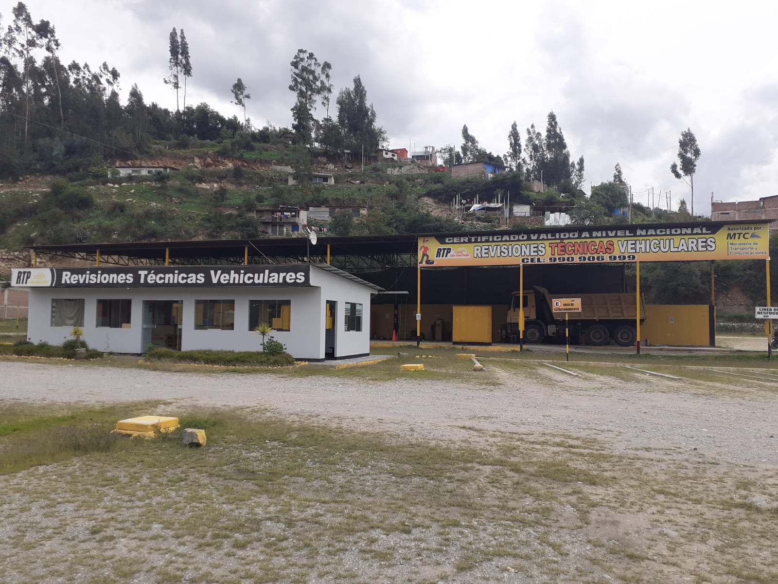 Image of a vehicle undergoing technical inspection in a modern facility